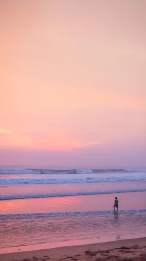 A Serene Afternoon At The Stunning Pink Beach Wallpaper