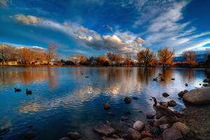 A Serene Sunrise Over Lake Reno Wallpaper