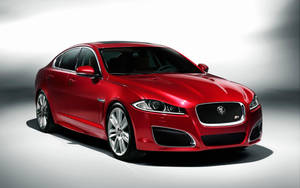 A Sharp And Luxurious Red Jaguar Wallpaper