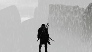 A Silhouette Of A Man Standing In The Rain Wallpaper