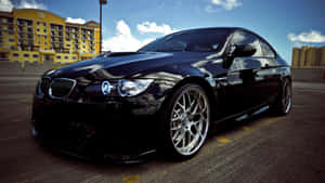 A Sleek And Stylish Bmw On The Open Road Wallpaper