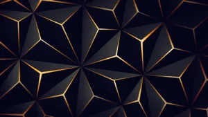 A Sleek Black And Gold Desktop Design Wallpaper