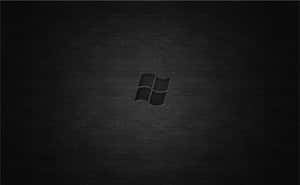 A Sleek Dark Desktop Background Set Against A Deep Brown And Black Textured Wallpaper Wallpaper