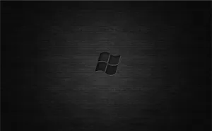 A Sleek Dark Desktop Background Set Against A Deep Brown And Black Textured Wallpaper Wallpaper