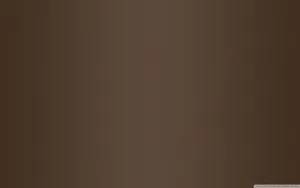 A Smooth And Dark Brown Backdrop Wallpaper