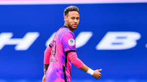 A Soccer Player In Pink And Blue Uniform Wallpaper