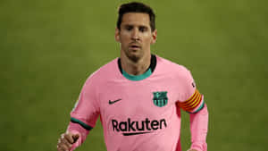 A Soccer Player In Pink Running On A Field Wallpaper