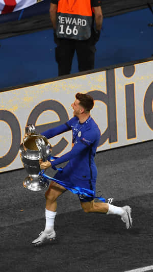 A Soccer Player Is Holding A Trophy Wallpaper