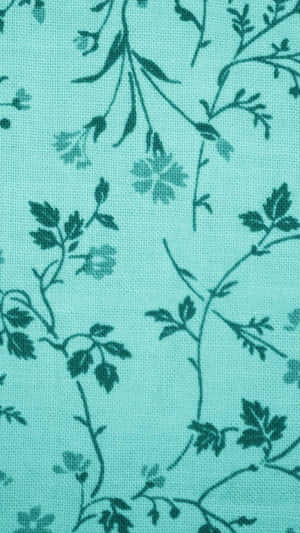 A Soft Teal Flower Petal Against A Dark Background Wallpaper