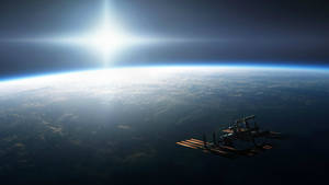 A Space Satellite Hovering Over The Surface Of Earth Wallpaper