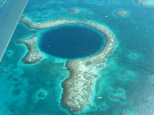 A Spectacular Aerial View Of The Great Blue Hole Wallpaper
