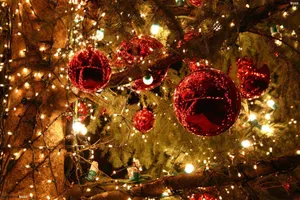 A Spellbinding Scene Of Christmas Lights And Red Balls Wallpaper