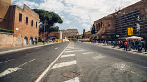 A Street With People Walking Down It Wallpaper