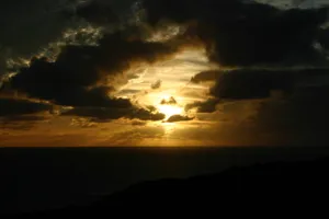 _ A Stunning Sunset Paints The Clouds In Vibrant Shades Of Orange And Pink_ Wallpaper