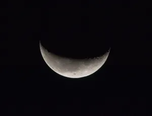 A Stunning View Of A Dark Moon Wallpaper