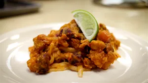 A Sumptuous Serving Of Creamy Pad Thai Noodles With Lime Wallpaper