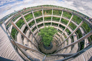 A Tall, Imposing Helical Forest Tower In The Midst Of A Beautiful Landscape. Wallpaper