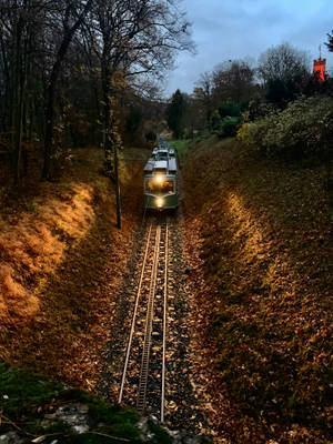 A Train Travelling Through The Countryside Wallpaper