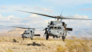 A Us Black Hawk Helicopter Flies Towards Its Destination In The Sky Wallpaper