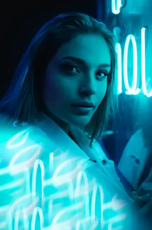 A Vibrant Display Of Neon Lights In The City Night Wallpaper