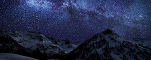 'a Vibrant Night In The Mountains' Wallpaper