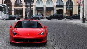 A Vibrant Red Ferrari F430 Caught In Motion Wallpaper