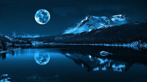 A View Of A Majestic Night Mountain Wallpaper