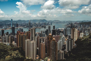 A View Of The Beautiful Victoria Harbour In Hong Kong Wallpaper