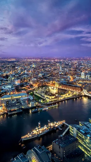A View Of The City Of London At Night Wallpaper