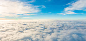 A View Of The Clouds From An Airplane Wallpaper