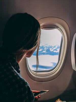 A View To Remember: Stunning Sunset From An Airplane Window. Wallpaper