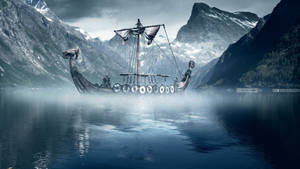 A Viking Longship Sailing Through The Seas Wallpaper