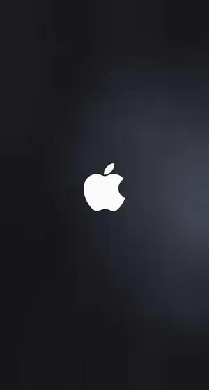 A Vivid White Apple Logo On A Dark Gray Background Wallpaper