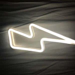 A White Neon Sign With A Lightning Bolt On It Wallpaper