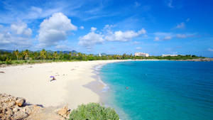 A Wide Shoreline In Sint Maarten Wallpaper