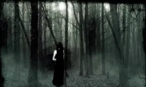 A Woman In A Dark Forest With A Flashlight Wallpaper