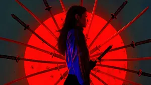 A Woman Standing In Front Of A Red Light With A Sword In Her Hand Wallpaper