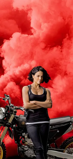 A Woman Standing Next To A Motorcycle Wallpaper