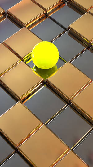 A Yellow Ball Is Sitting On A Tiled Floor Wallpaper