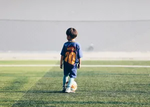 A Young Hopeful Looks Forward To One Day Wearing Lionel Messi's Jersey. Wallpaper