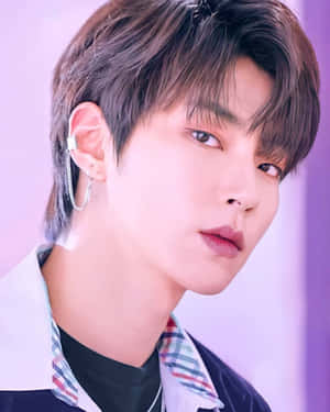 A Young Man With A Pierced Ear Wallpaper