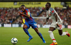 Aaron Wan-bissaka Bright Blue Bottoms Wallpaper