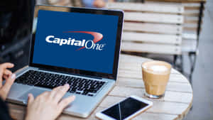 Accessing Capital One Services Via Laptop Wallpaper