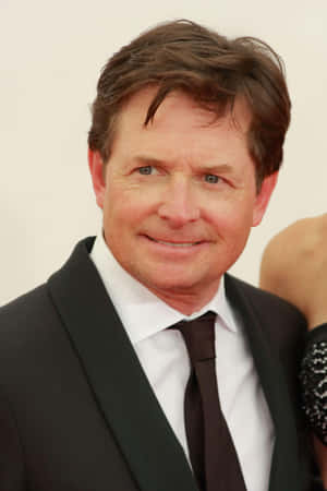 Actor Michael J Fox Brings Laughter And Joy Wallpaper