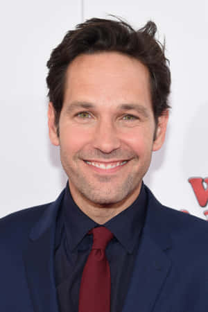 Actor Paul Rudd Strikes A Charming Smile Wallpaper