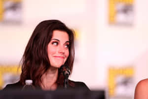 Actress Smiling During Panel Discussion Wallpaper