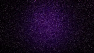 Add A Touch Of Luxe To Any Room With A Splash Of Purple Glitter Wallpaper