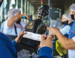 Adictivo Reposado Tequila In Premium Glass Bottle Wallpaper