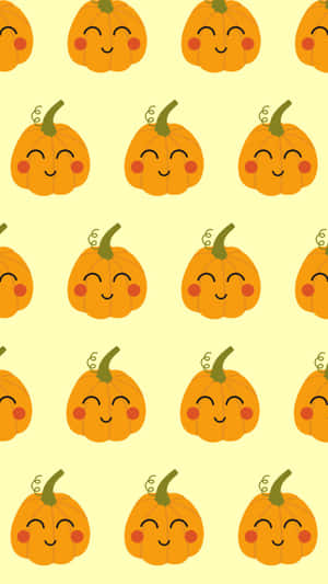 Adorable Pumpkins Embracing The Season Wallpaper