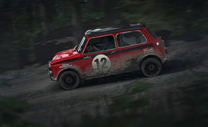 Adrenaline Rush With Dirt Rally Car Racing Wallpaper